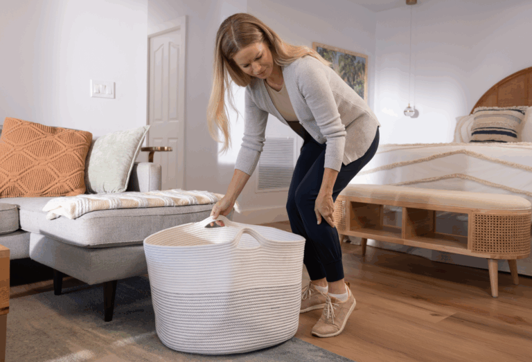 Woman at home grabbing her leg that is cramping wondering what to do abut her leg cramps